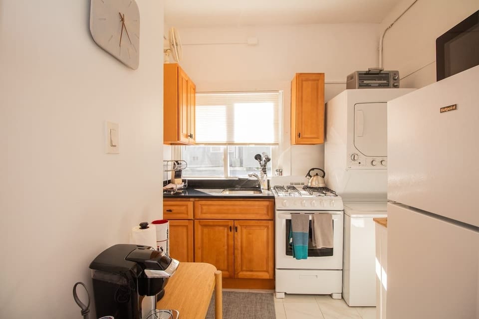 Kitchen, Gas Range, Washer and Dryer in unit
