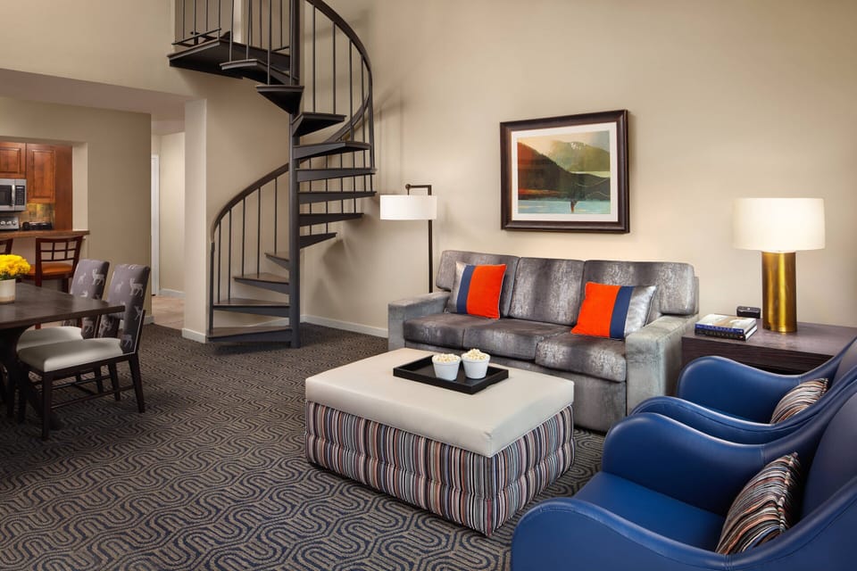 Living-Room offers a queen sofa bed and a twin bed ottoman. 