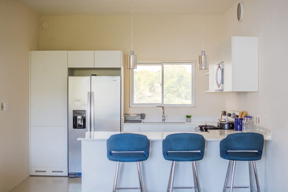Enjoy breakfast in the kitchen with the convenience of bar stools