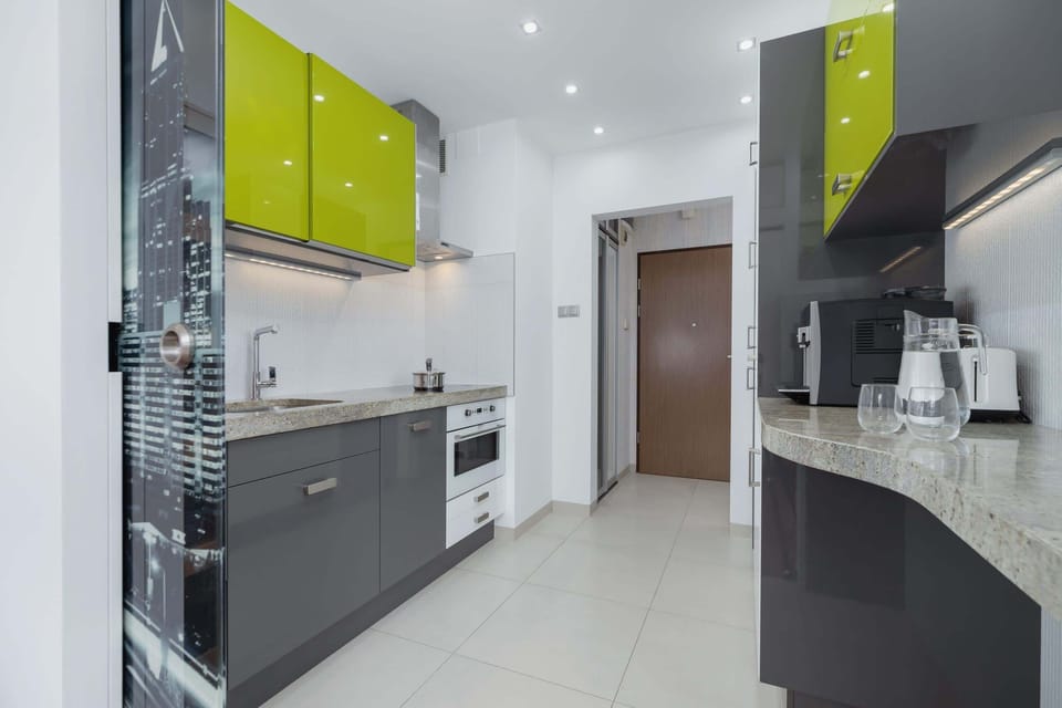 Kitchen with oven and refrigerator. 
