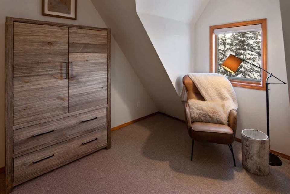 Armoire and sitting area in 3rd bedroom.