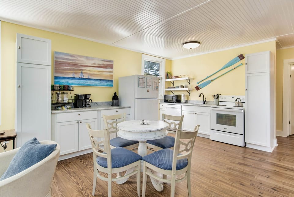 As you dine, take in the views of the kitchen and living room, creating a warm and connected atmosphere.