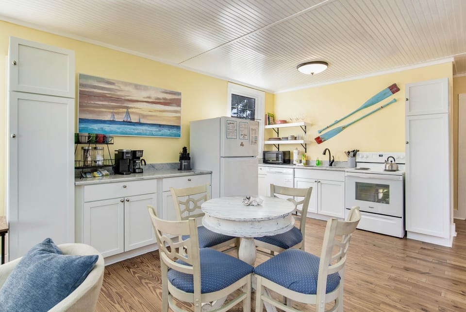 The inviting dining area, located at the heart of the open-floor plan, seats four.