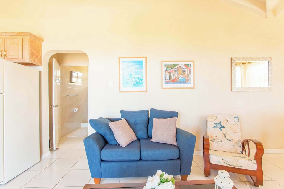High vaulted wood beam ceilings add to the airy, beachy feel