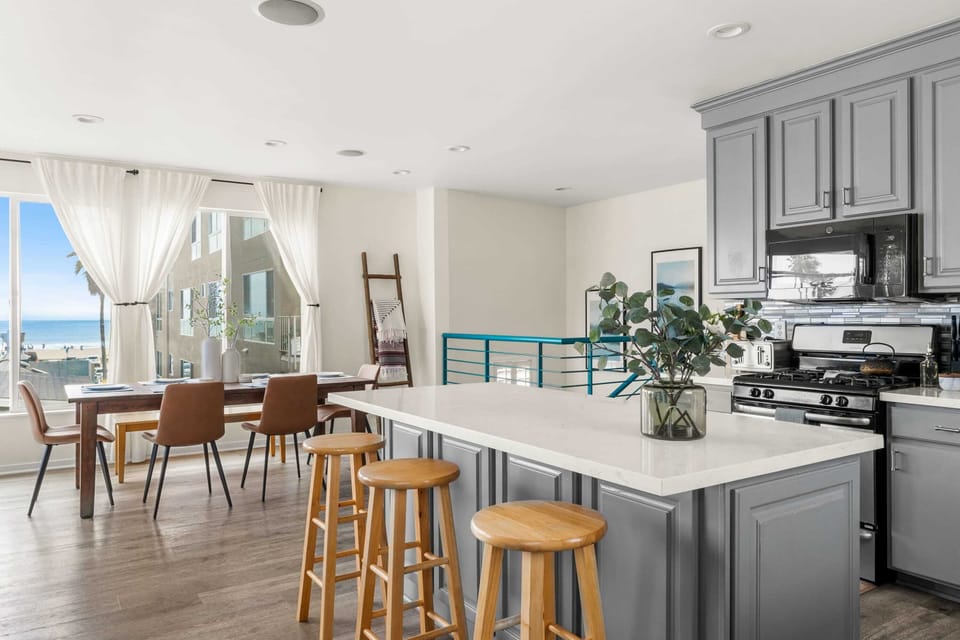 Bright and airy kitchen with stunning ocean views, perfect for cooking and enjoying meals with a breathtaking backdrop