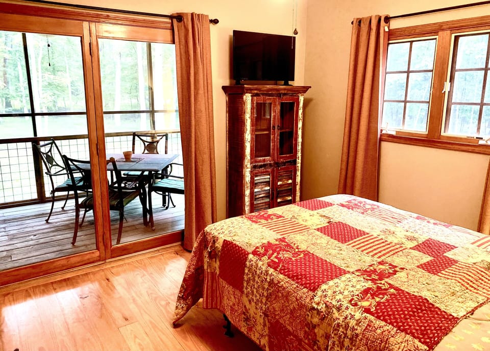 Watch the deer roam in the backyard from under the covers of this cozy bed