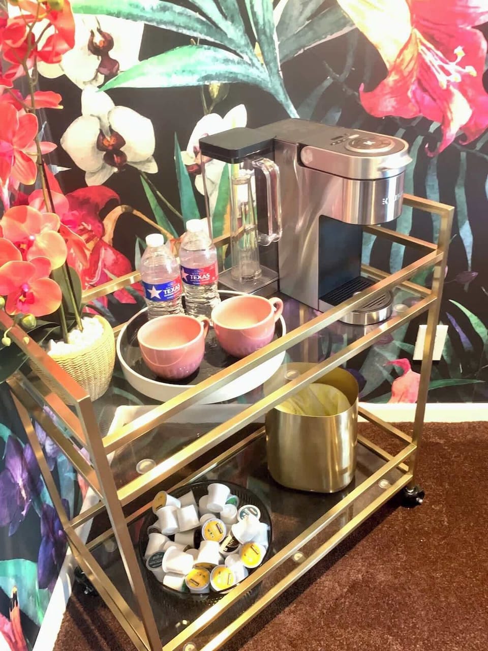 Tea cart w/Keurig machine and a variety of teas for you to enjoy in the comfort of the master bedroom.