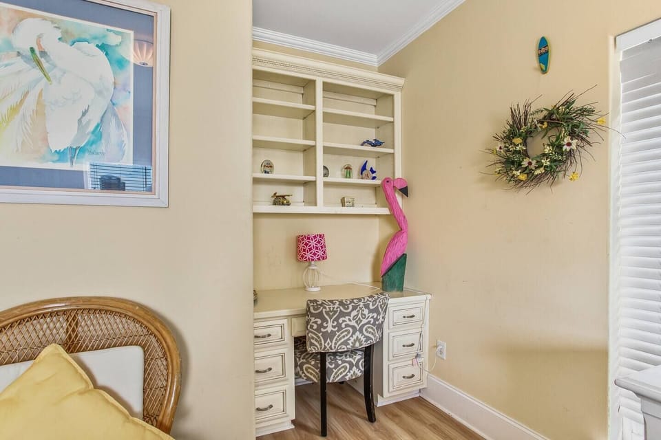 Guest bedroom with desk workspace — ideal for remote work or trip planning.