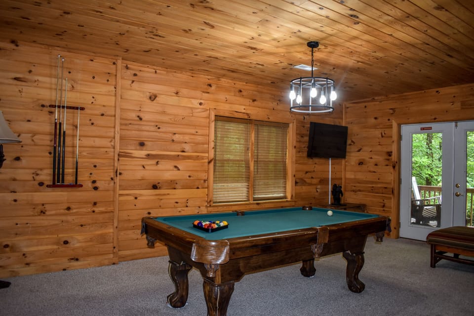 Game room with pool table and new smart tv 