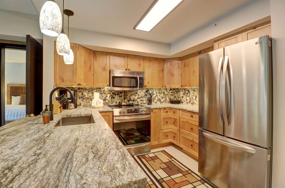 The kitchen features stainless steel appliances.