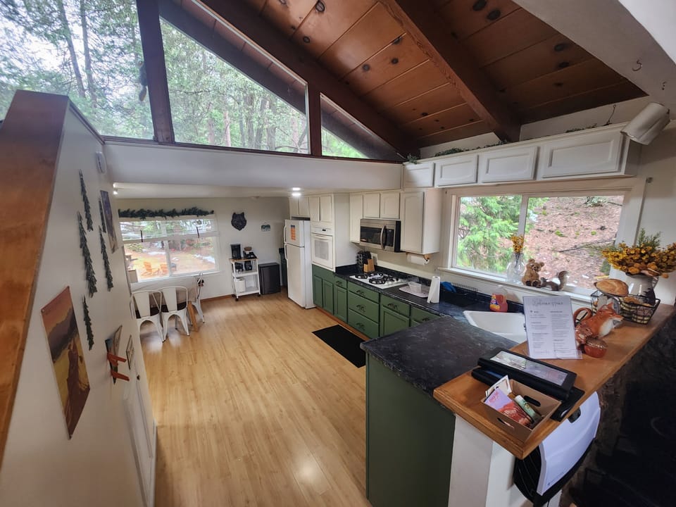 Kitchen with beautiful view of large yard with view of common deer visitors.