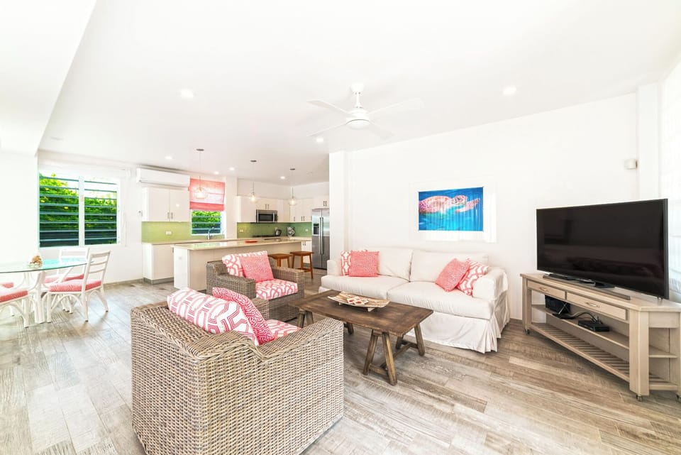 Open area showing living room, dinning and kitchen area. 