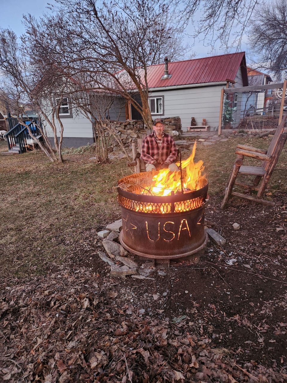The fire pit, that John made.  There is wood to go with.