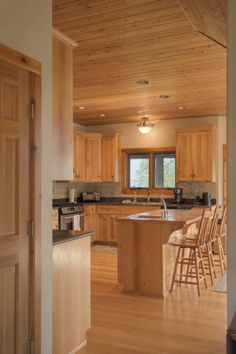 We love this view of the kitchen from the entryway--so inviting!
