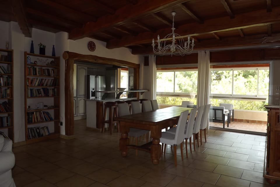 Dining area, with kitchen beyond.