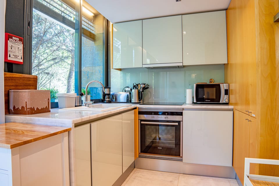 Kitchen with all equipment and dining space.