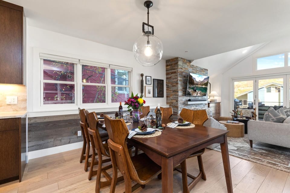 Share meals at your dining table for eight, with stylish lighting and easy access to the kitchen and patio.