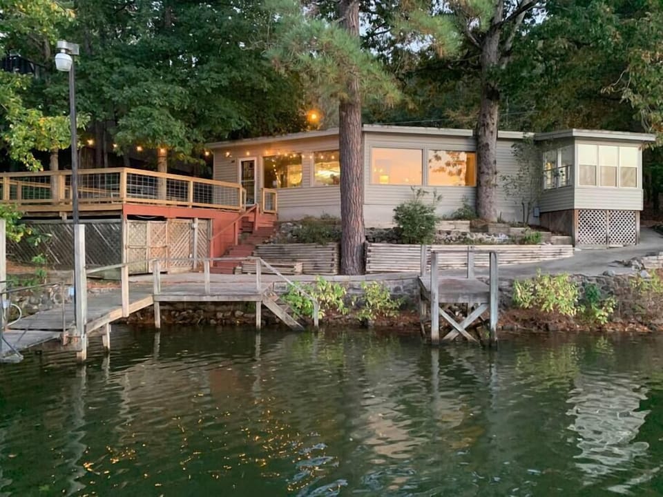 House is set in the trees right on the water in a quiet cove.