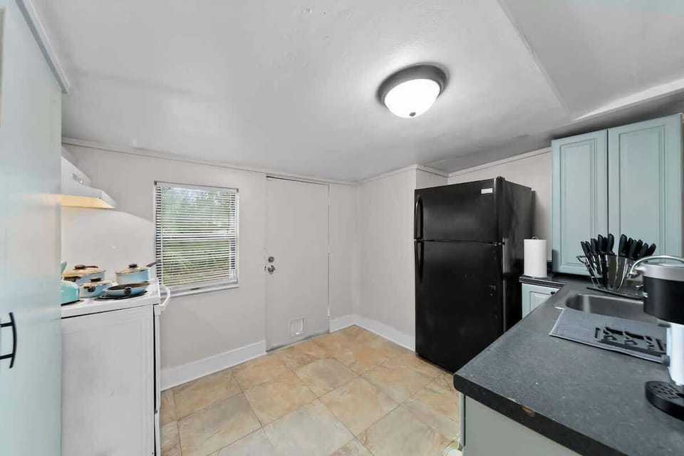 Kitchen comes fully stocked with:
- Stove & Oven
- Full Size Fridge
- Toaster
- K-Cup Coffee with K Cups 
    - Breakfast, Normal, & Decaf
- Home Hero knife set
- Pots, Pans and a kettle
- Silverware
- 4 sets of plates, bowls, & cups
- 2 wine glasses