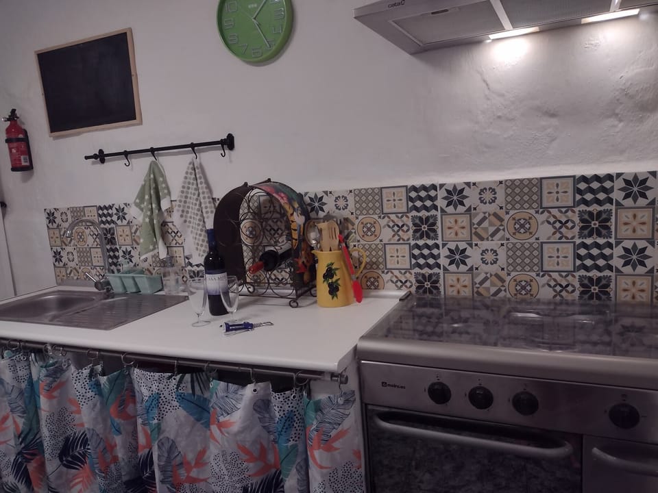 Kitchenette.....sink and cooker with cooker hood.