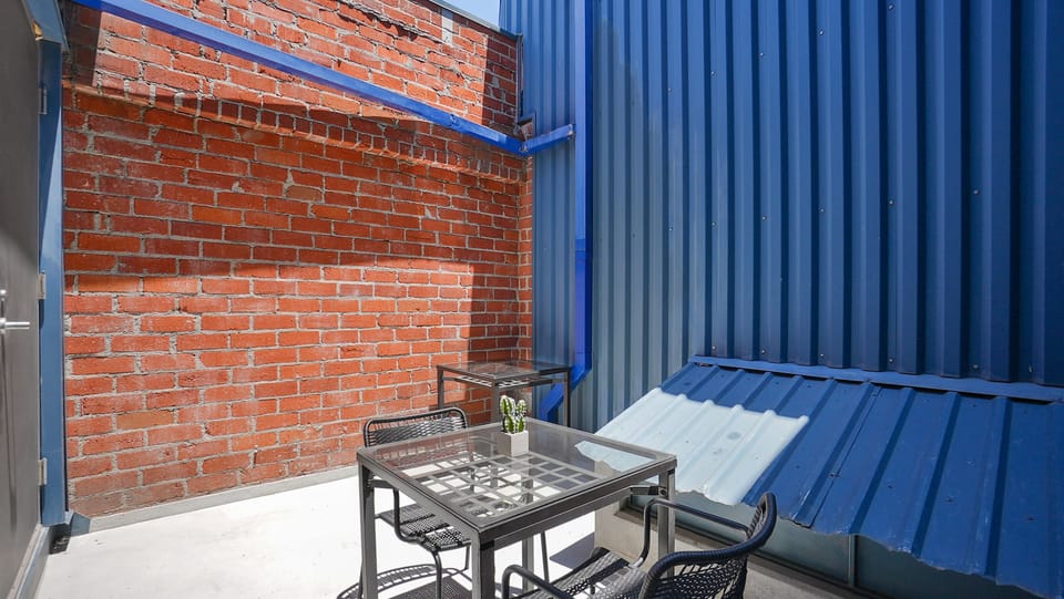 This private outdoor patio is equally suited for a morning cup of coffee or dining underneath the stars on a warm summer night.
