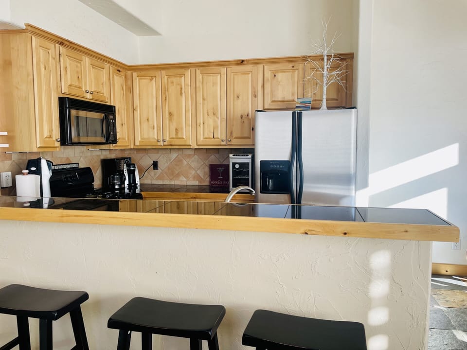 Custom kitchen with wine cooler and every appliance 