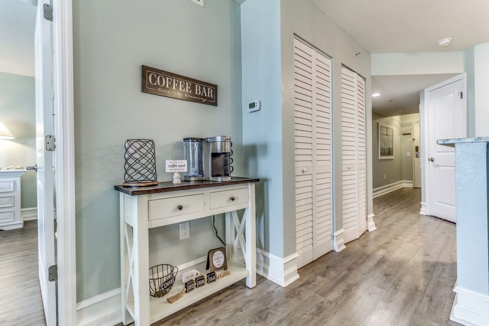 Start each morning with fresh coffee from your private coffee bar station, perfectly positioned in this welcoming coastal-styled space.