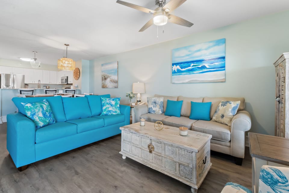 Sink into coastal comfort with ocean-inspired décor, plush seating, and your fully equipped kitchen just steps away for seaside snacks.