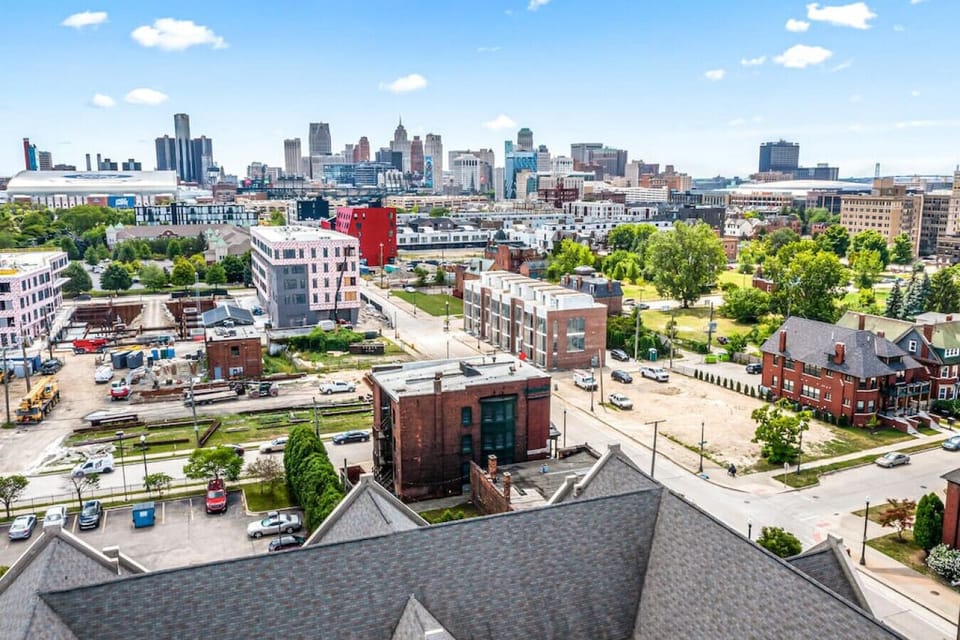 Drone photo of the Aurora and its proximity to downtown Detroit, Ford Field, Comerica Park, and Little Caeser's Arena.