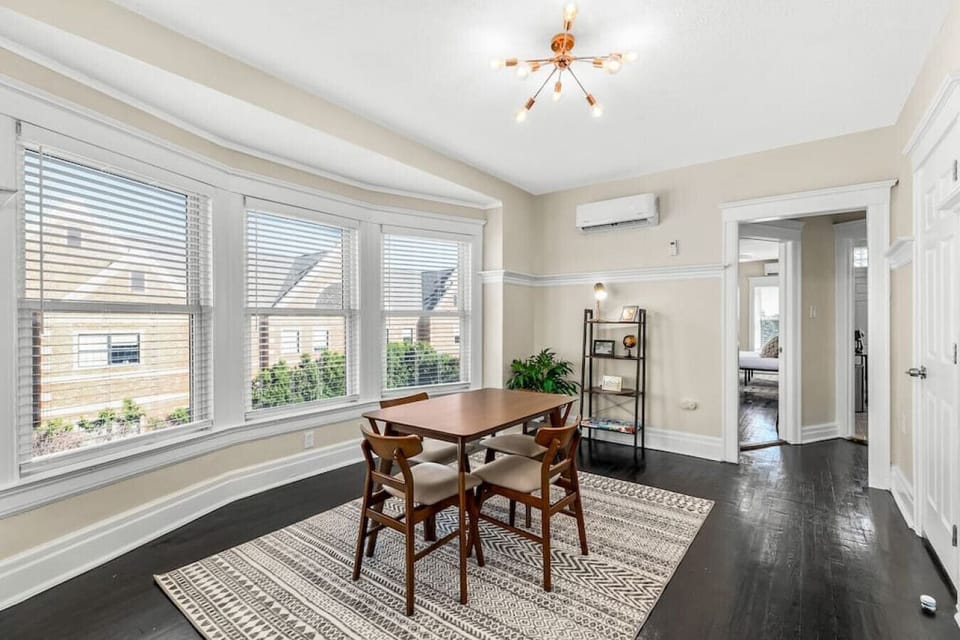 The 100+ year old hardwood floors shine throughout the unit.