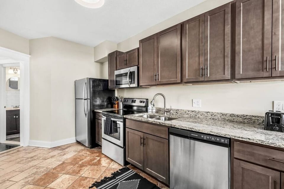 Stainless steel appliances shine in this recently renovated kitchen.