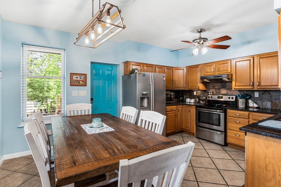 The large eat-in Kitchen is great for gathering, and provides easy access to the back Patio.