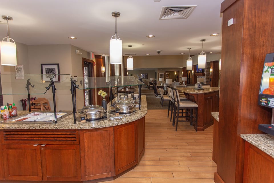 Complementary  daily breakfast bar featuring an assortment of dishes.