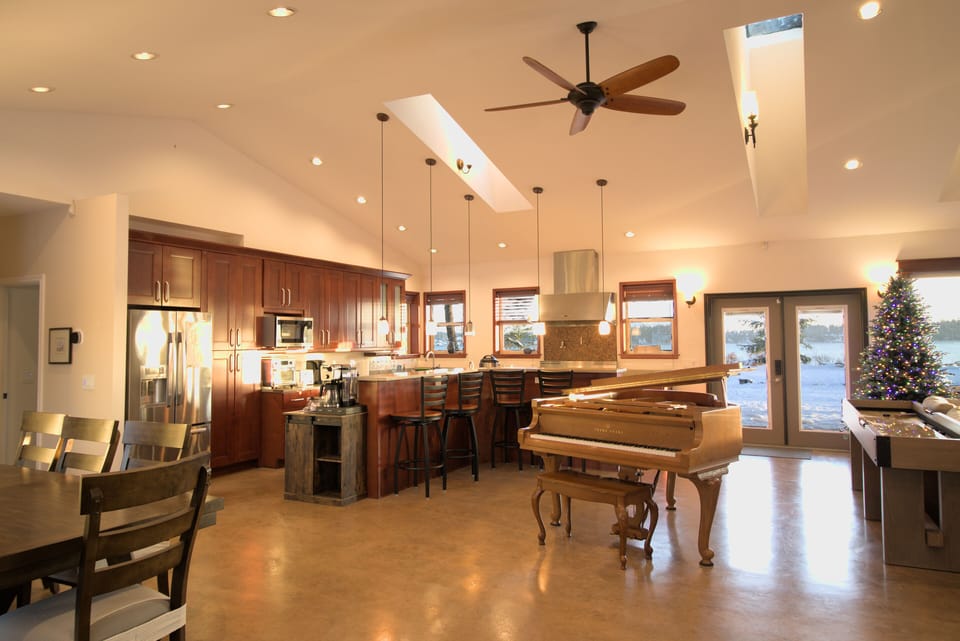 Baby grand piano. Christmas tree for the holiday season.