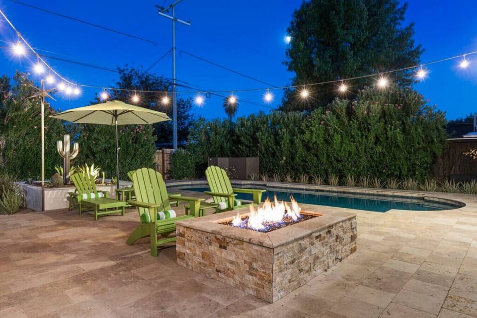 Grab a drink and relax by the fire while the string lights set the mood.