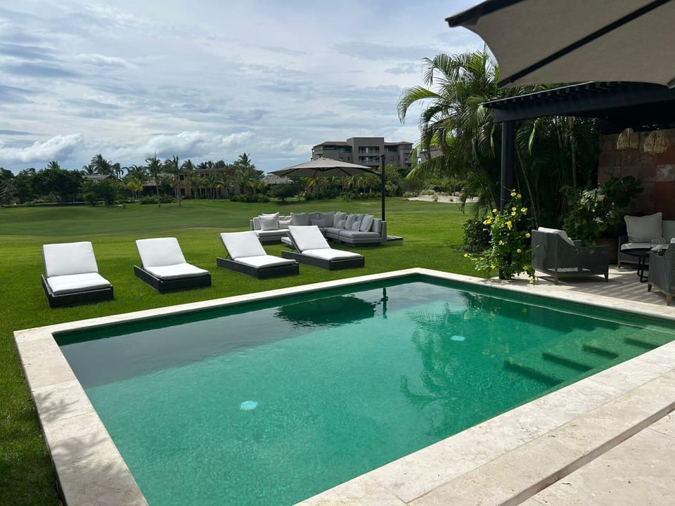 Private pool surrounded by lush tropical landscaping