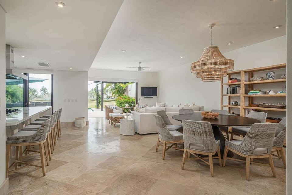 Indoor-outdoor living with sliding glass doors to the patio and pool
