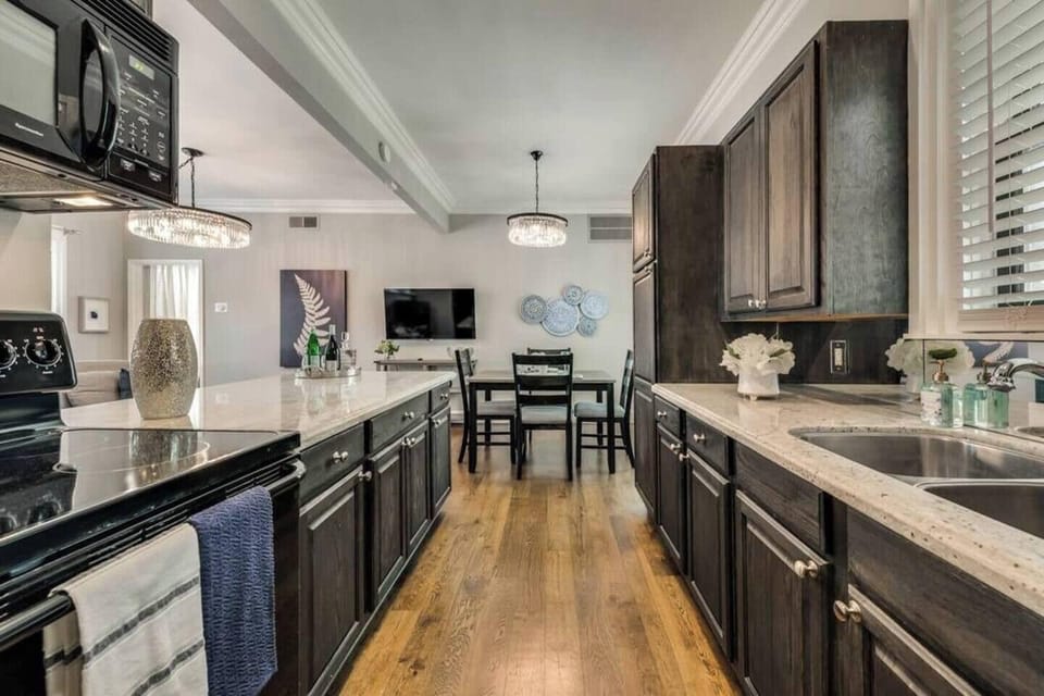 Full size kitchen with beautiful marble countertops.