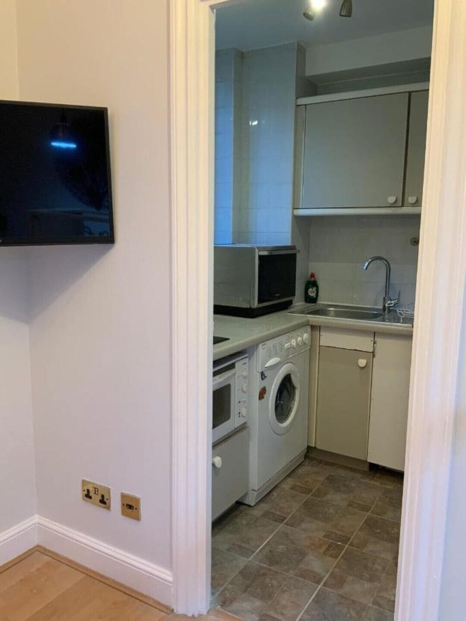 Wall mounted Smart wifi TV, outside kitchenette.