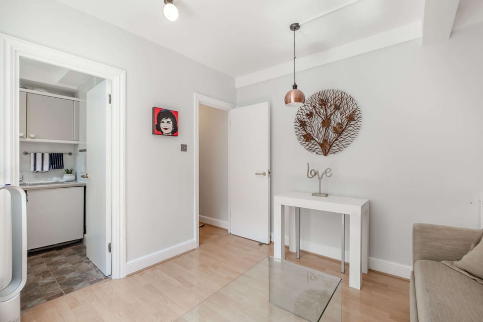 Exit the living room to the corridor, and to the main exit door with code lock.