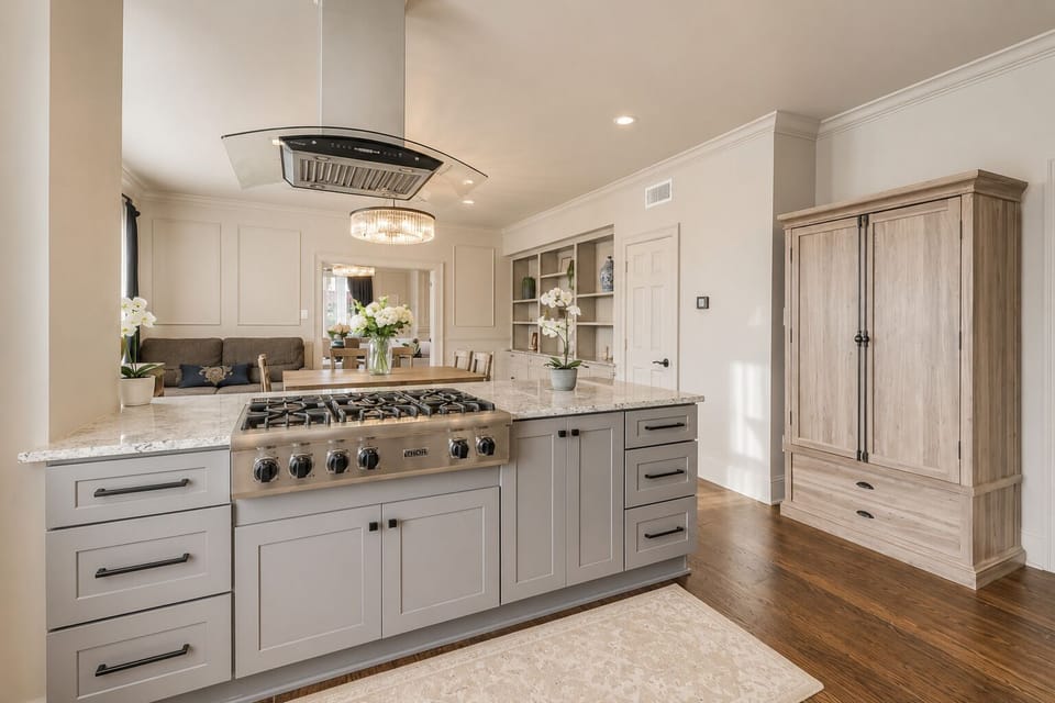 The fully equipped kitchen features a spacious island, plenty of counter space, and stunning marble countertops. With abundant natural light, it's the perfect space for preparing a gourmet meal or entertaining guests.