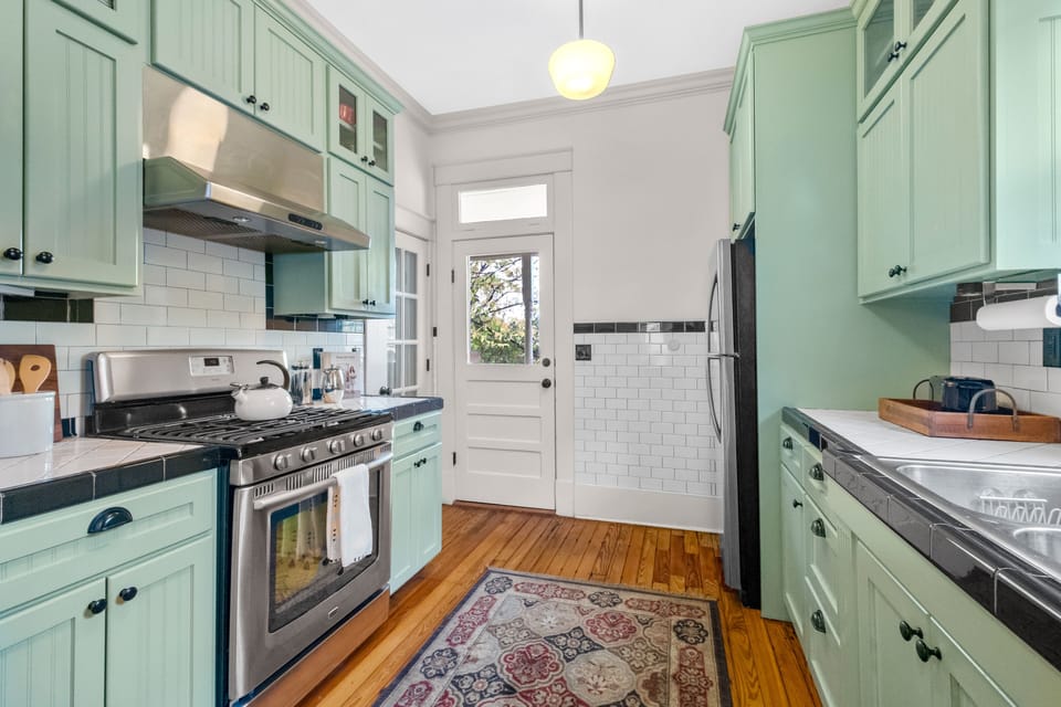 The Kitchen has a back door leading to the outdoor grill and deck
