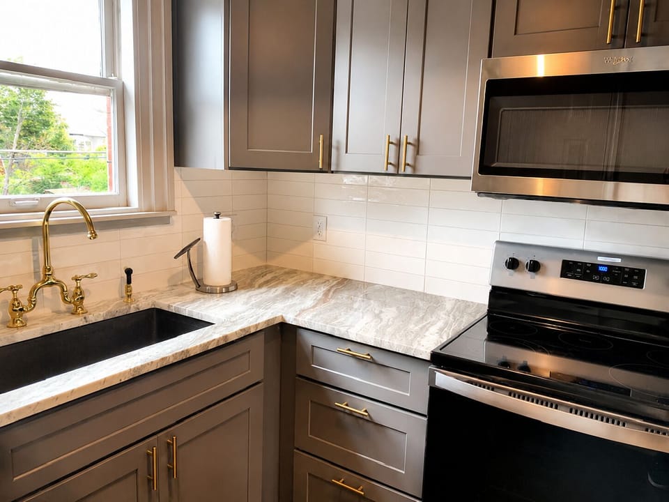 A fully equipped kitchen with elegant marble countertops and top-of-the-line appliances, perfect for any culinary endeavor.