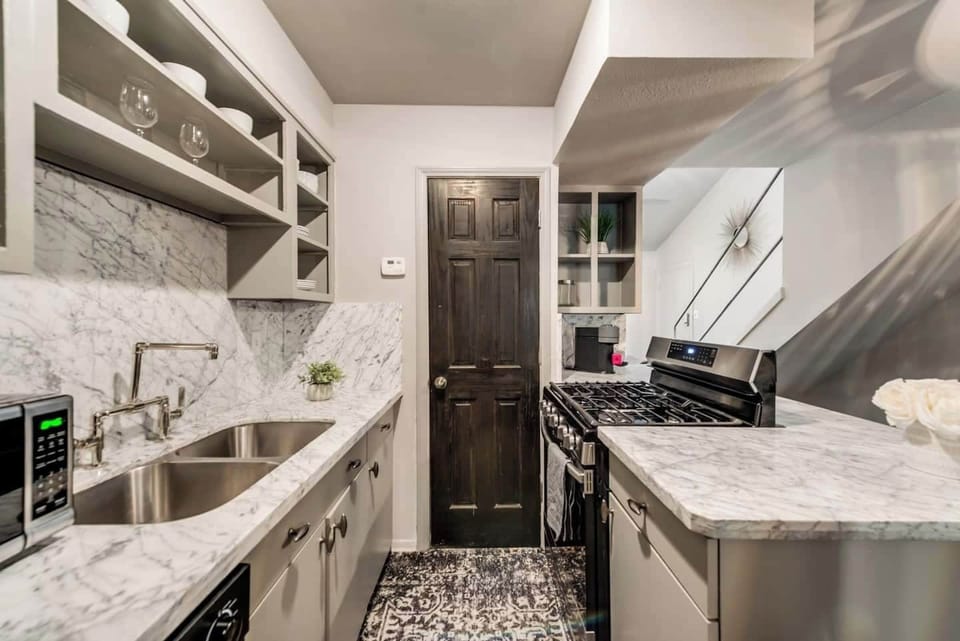 Kitchen with gas range, Nespresso machine, microwave and all appliances/kitchen essentials.