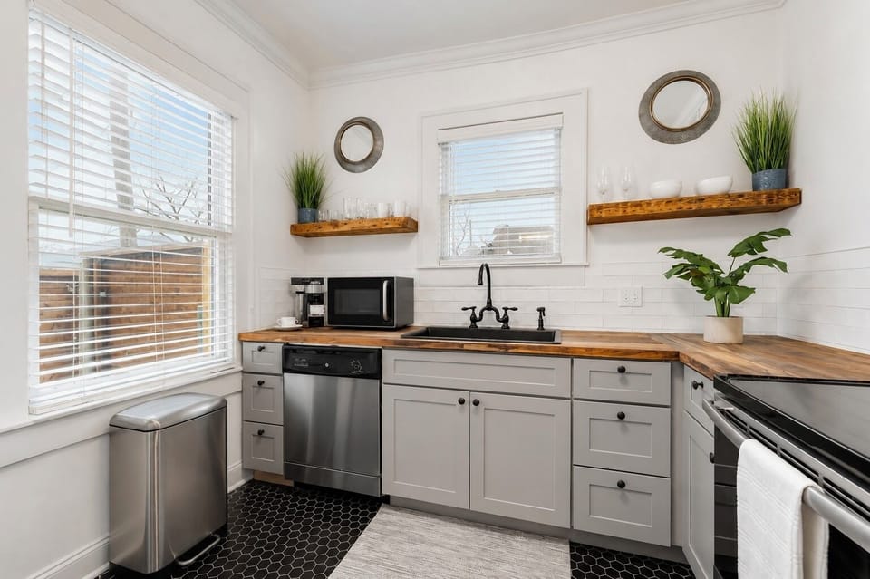 The kitchen is fully equipped with all the essentials and modern appliances, making it perfect for preparing meals with ease and convenience.