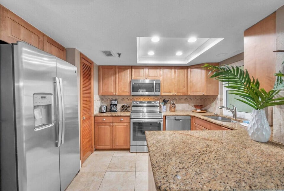 Well-appointed kitchen w/ generous prep space, ideal for cooking and gathering.