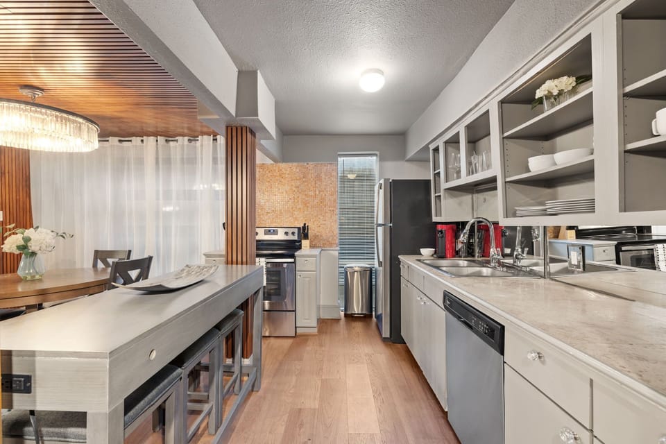 Chef’s Kitchen – Stainless steel appliances and generous counter space for easy meal prep.