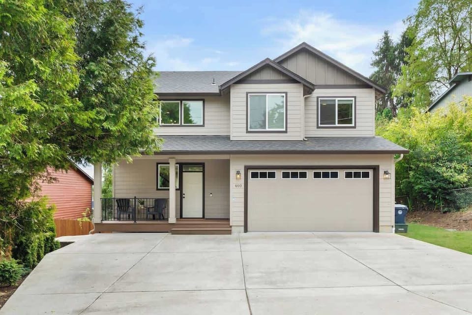 Front driveway with parking for at least 3 vehicles.