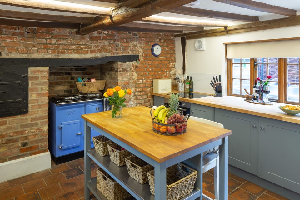 The cottage's kitchen includes an oak top breakfast bar