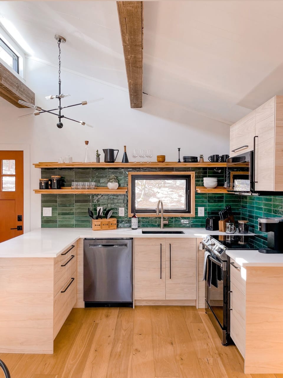 The fully-stocked chic kitchen has everything you need.